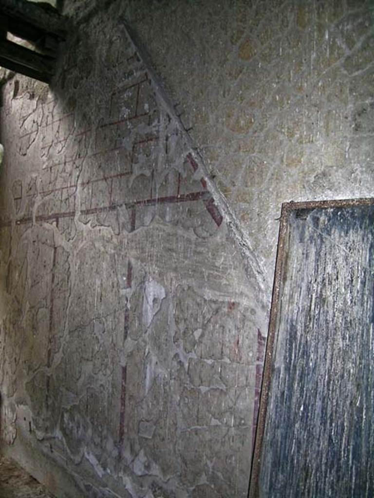 V.16, Herculaneum. May 2004. East wall, with site of stairs to upper floor apartment.
Photo courtesy of Nicolas Monteix.